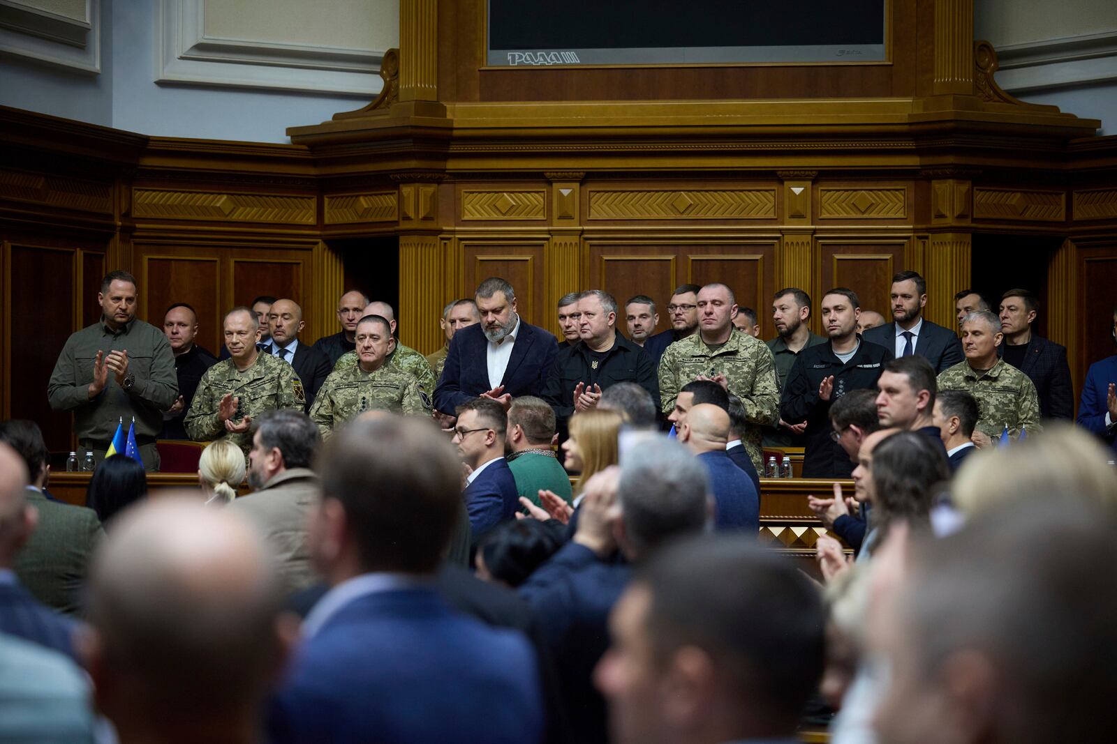 In this photo provided by the Press Service Of The President Of Ukraine on Oct. 16, 2024, Head of Ukrainian Presidential Office Andriy Yermak,left, Commander-in-Chief of the Armed Forces of Ukraine General Oleksandr Syrskyi, Lieutenant Generel Bargilevich Anatoly Chief of the General Staff of the Armed Forces of Ukraine, Oleksandr Lytvynenko Head of Foreign Intelligence Service of Ukraine, Maj. Gen. Vasyl Maliuk Chief of Ukraine's Security Service, Maj. Gen. Kyrylo Budanov, Ukraine's military intelligence chief, listen a speech of Ukraine's President Volodymyr Zelenskyy at Verkhovna Rada in Kyiv, Ukraine. (Press Service Of The President Of Ukraine via AP)