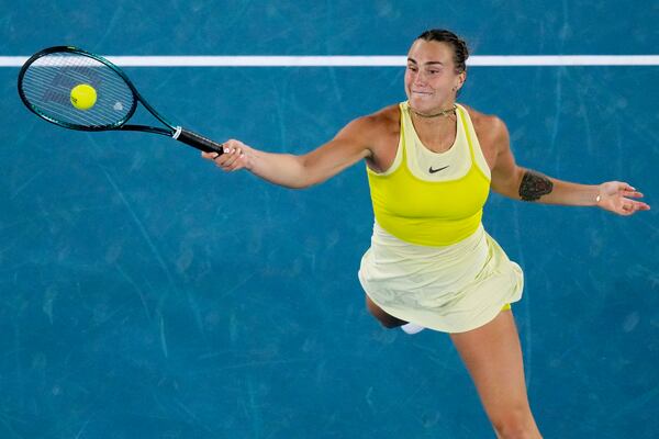 Aryna Sabalenka of Belarus plays a forehand return to Paula Badosa of Spain during their semifinal match at the Australian Open tennis championship in Melbourne, Australia, Thursday, Jan. 23, 2025. (AP Photo/Vincent Thian)