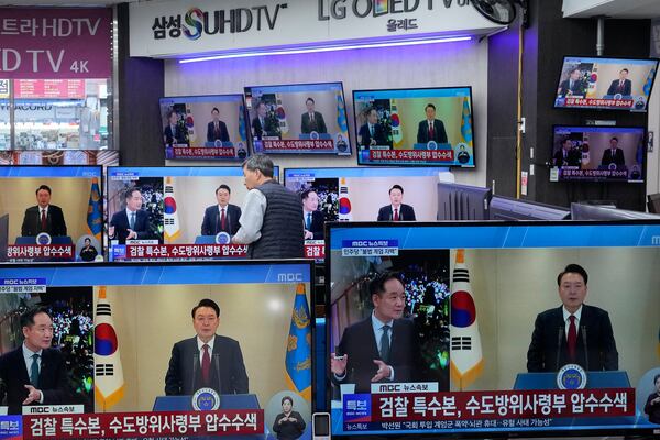 TV screens show the broadcast of South Korean President Yoon Suk Yeol's speech at the Yongsan Electronic store in Seoul, South Korea, Thursday, Dec. 12, 2024. (AP Photo/Ahn Young-joon)