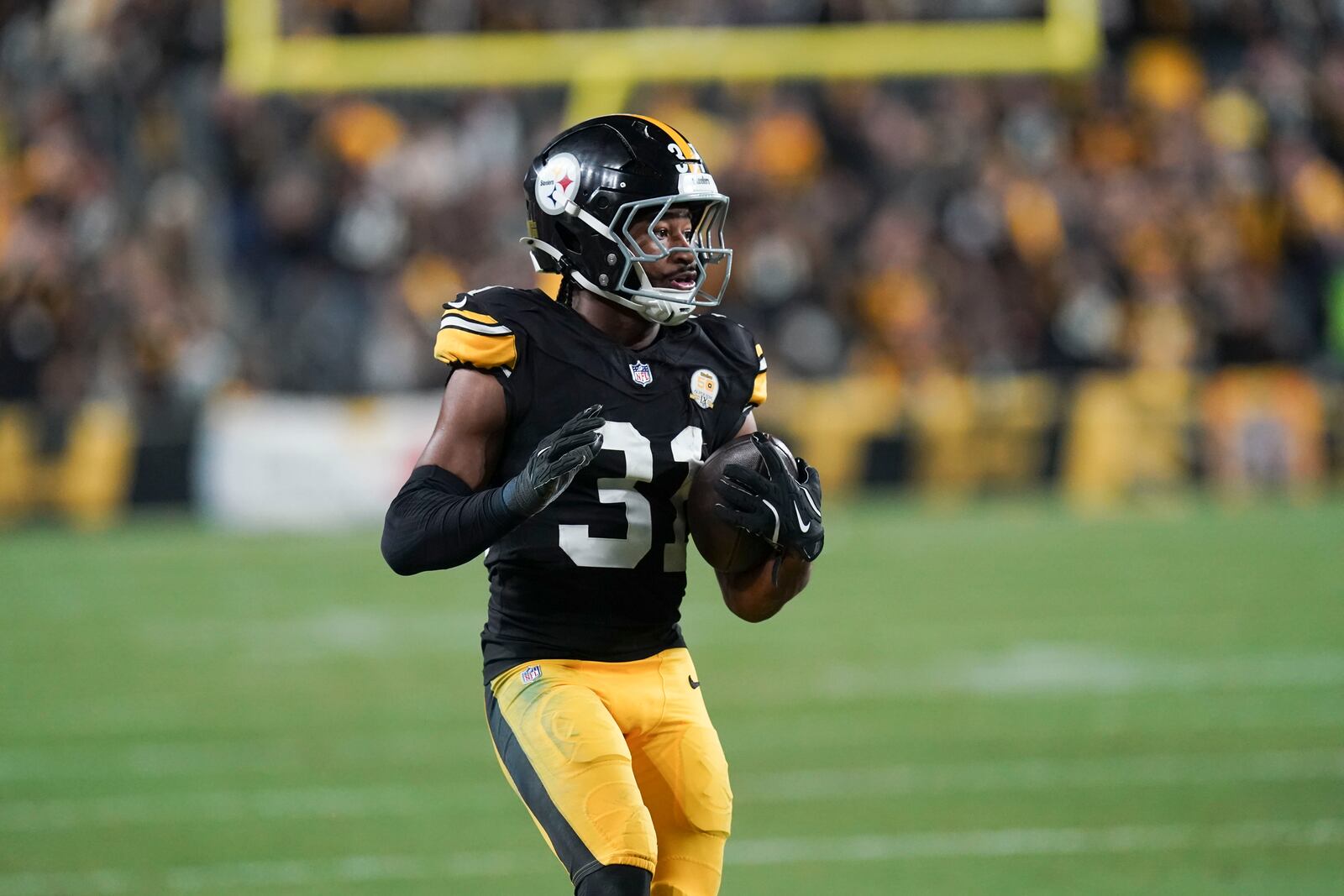 Pittsburgh Steelers cornerback Beanie Bishop Jr. (31) returns an interception in the second half of an NFL football game against the New York Jets in Pittsburgh, Sunday, Oct. 20, 2024. (AP Photo/Matt Freed)