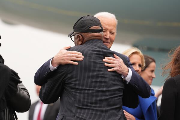 202President Joe Biden embraces Rep. James Clyburn, D-S.C., as he arrives on Air Force One at Charleston Air Force Base in Charleston, S.C., Sunday, Jan. 19, 2025. (AP Photo/Stephanie Scarbrough)