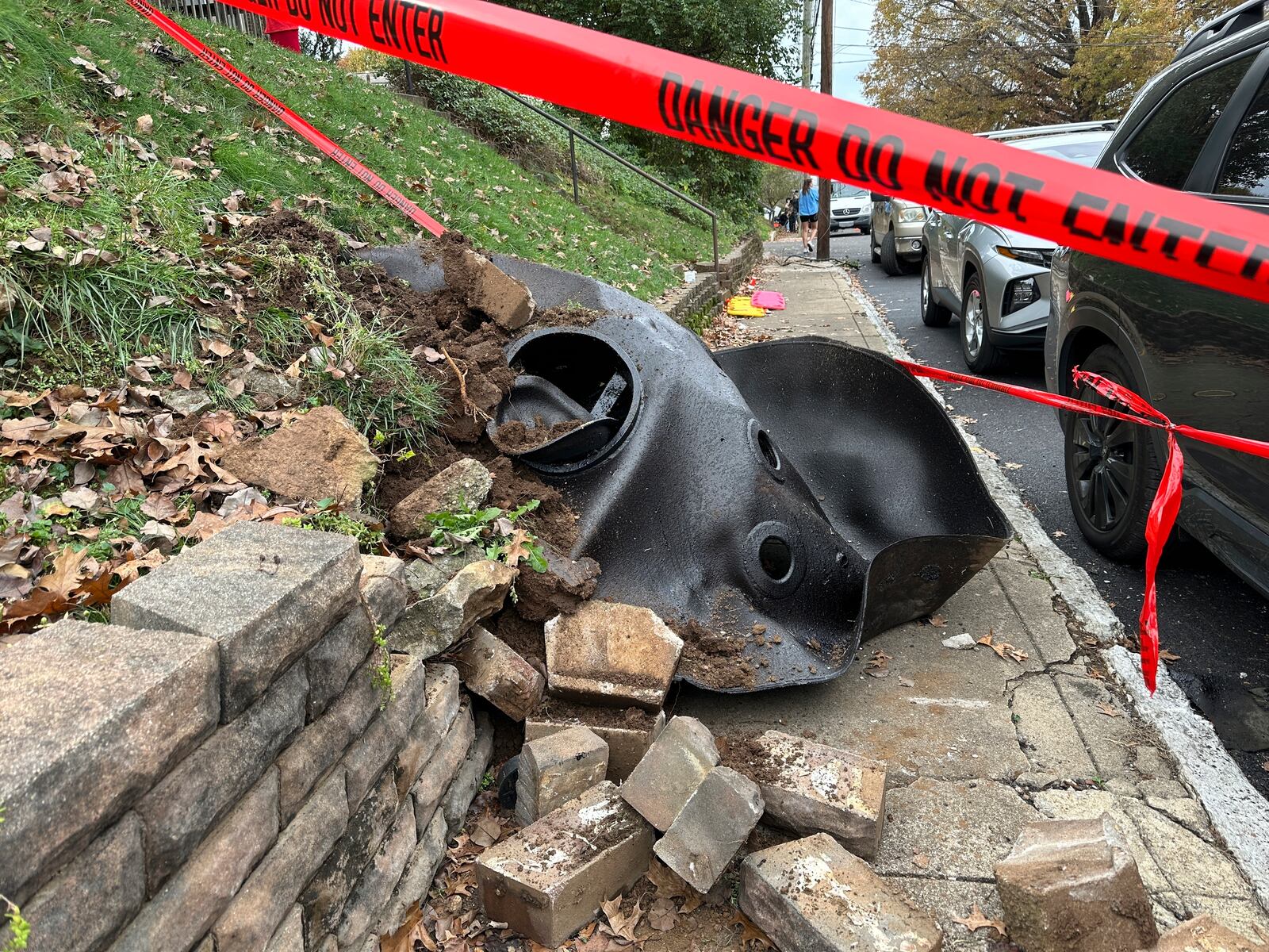 A large metal piece of debris that was flung across a street by a blast at a Louisville, Ky, plant is shown on Wednesday, Nov. 13, 2024. Two workers died in the explosion at the Givaudan Color Sense plant in Louisville. (AP Photo/Dylan Lovan)