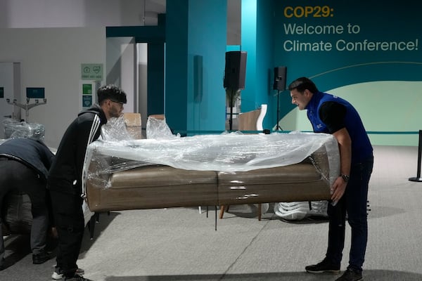 Furniture is wrapped up during the COP29 U.N. Climate Summit, Friday, Nov. 22, 2024, in Baku, Azerbaijan. (AP Photo/Rafiq Maqbool)