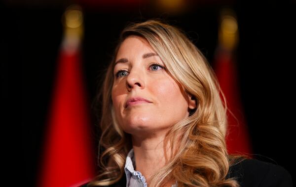 Canada's Minister of Foreign Affairs Melanie Joly speaks to reporters prior to a meeting during a cabinet retreat at Chateau Montebello in Montebello, Quebec, Monday, Jan. 20, 2025. (Sean Kilpatrick/The Canadian Press via AP)