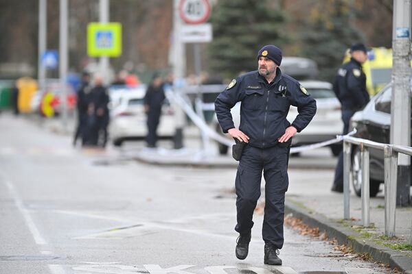 Police secure access to the elementary school where a 7-year-old girl died and a teacher and five other students were wounded in a knife attack in Zagreb, Croatia, Friday, Dec. 20, 2024. (AP Photo/Damir Krajac)