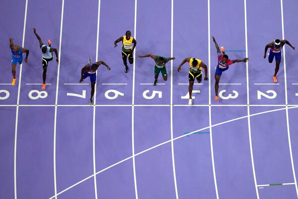 FILE - Noah Lyles, of the United States, in lane seven, wins the men's 100-meter final at the 2024 Summer Olympics, Sunday, Aug. 4, 2024, in Saint-Denis, France. (AP Photo/David J. Phillip, File)