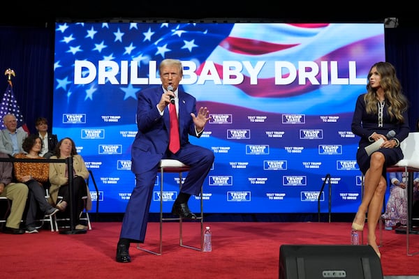 FILE - Republican presidential nominee former President Donald Trump speaks at a campaign town hall at the Greater Philadelphia Expo Center & Fairgrounds, Oct. 14, 2024, in Oaks, Pa., as moderator South Dakota Gov. Kristi Noem listens. (AP Photo/Alex Brandon)