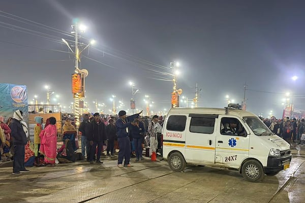 An ambulance leaves the site of a stampede at the Sangam, the confluence of the Ganges, the Yamuna and the mythical Saraswati rivers, on Mauni Amavasya' or new moon day during the Maha Kumbh festival, in Prayagraj, Uttar Pradesh, India, Wednesday, Jan. 29, 2025. (AP Photo/Rajesh Kumar Singh)