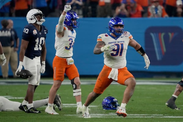 Boise State defensive end Ahmed Hassanein (91) celebrates a defensive stop against Penn State during the first half of the Fiesta Bowl NCAA college football CFP quarterfinal game, Tuesday, Dec. 31, 2024, in Glendale, Ariz. (AP Photo/Rick Scuteri)