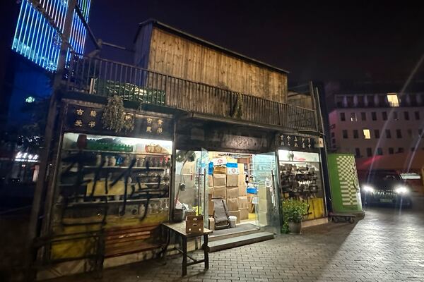 "Fatty Wang's Bookstore" with the words "temporarily closed" spray painted on the glass wall is seen in Ningbo, in eastern China's Zhejiang province, Oct. 9, 2024. (AP Photo/Dake Kang)