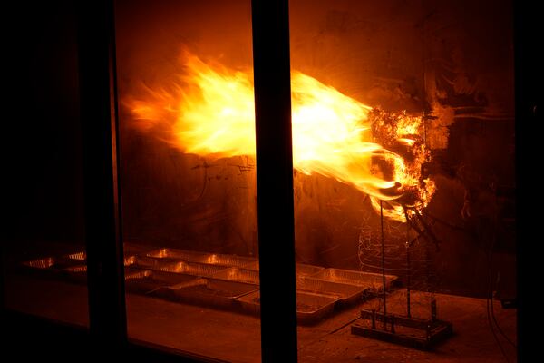 Brush burns in a wind tunnel in lab at Worcester Polytechnic Institute, Wednesday, Jan. 15, 2025, in Worcester, Mass. (AP Photo/Robert F. Bukaty)