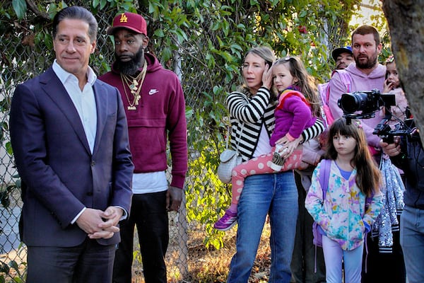 Los Angeles Unified Superintendent Alberto M. Carvalho greets students from Palisades Charter Elementary School upon their arrival at the Brentwood Elementary Science Magnet school in the Brentwood section of Los Angeles on Wednesday, Jan. 15, 2025. (AP Photo/Richard Vogel)