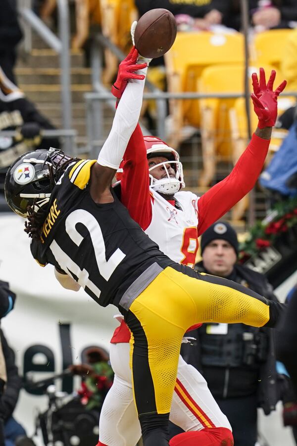 Pittsburgh Steelers cornerback James Pierre (42) breaks up a pass intended for Kansas City Chiefs wide receiver DeAndre Hopkins (8) during the first half of an NFL football game, Wednesday, Dec. 25, 2024, in Pittsburgh. (AP Photo/Matt Freed)