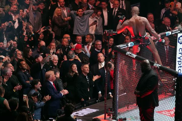 President-elect Donald Trump watches as Jon Jones reacts after defeating Stipe Miocic at UFC 309 at Madison Square Garden, early Sunday, Nov. 17, 2024, in New York. (AP Photo/Evan Vucci)