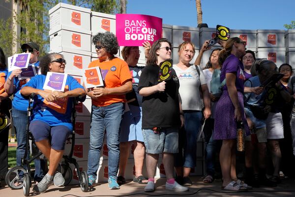 FILE - Arizona abortion-rights supporters gather for a news conference prior to delivering over 800,000 petition signatures to the capitol to get abortion rights on the November general election ballot Wednesday, July 3, 2024, in Phoenix. (AP Photo/Ross D. Franklin, File)