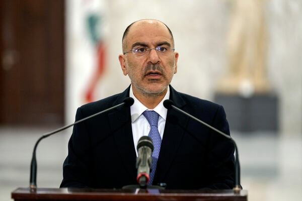 Antoine Shoukeir, the presidency's director general, announces that Nawaf Salam, a prominent diplomat and jurist is now prime minister-designate at the presidential palace in Baabda, east of Beirut, Lebanon, Monday, Jan. 13, 2025. (AP Photo/Bilal Hussein)