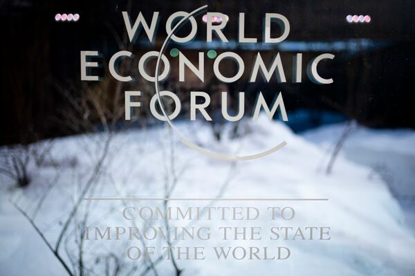 The logo of the World Economy Forum displayed on a window at the Congress Center where the annual meeting of World Economic Forum will take place, in Davos, Switzerland, Sunday, Jan. 14, 2024. (AP Photo/Markus Schreiber)