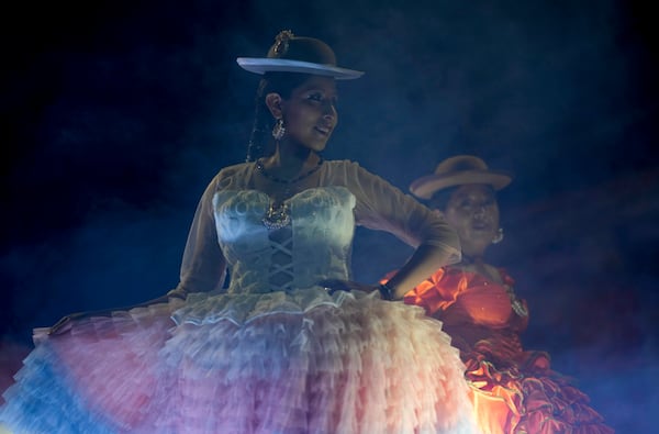 Women model creations by a local designer at a Chola fashion show, promoting the Andean style and beauty of Aymara women, in Viacha, Bolivia, Friday, Nov. 29, 2024. (AP Photo/Juan Karita)