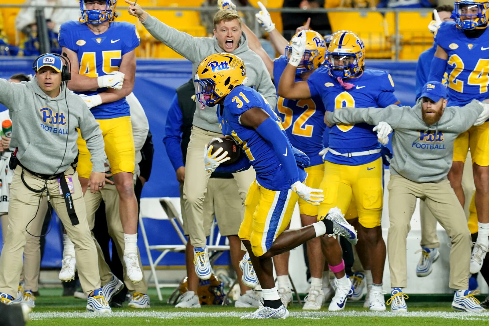 Pittsburgh linebacker Rasheem Biles (31) returns an interception for a touchdown during the first half of an NCAA college football game against Syracuse, Thursday, Oct. 24, 2024, in Pittsburgh. (AP Photo/Matt Freed)