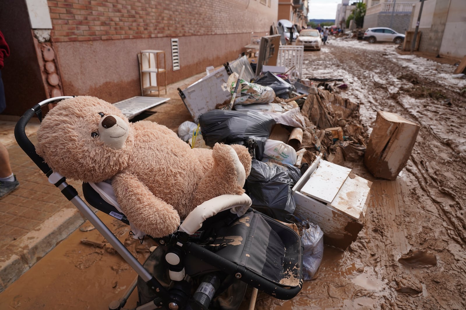 People's belongings sit in the mud after floods in Massanassa, just outside of Valencia, Spain, Saturday, Nov. 2, 2024. (AP Photo/Alberto Saiz)