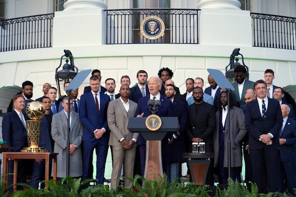 President Joe Biden, center, speaks during an event to welcome the Boston Celtics and celebrate their victory in the 2024 National Basketball Association Championship, on the South Lawn of the White House in Washington, Thursday, Nov. 21, 2024. (AP Photo/Susan Walsh)