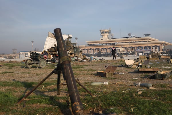 Military equipment is scattered outside the airport as opposition fighters control the facility in Aleppo Monday, Dec. 2, 2024. .(AP Photo/Omar Albam)