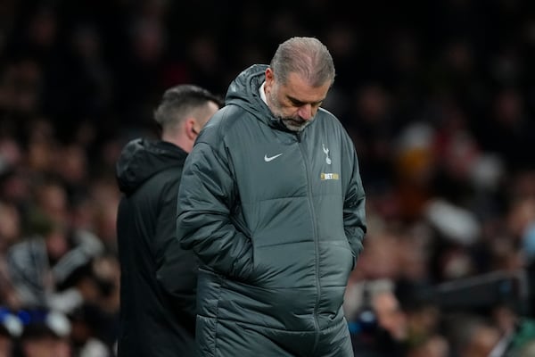 Tottenham's head coach Ange Postecoglou reacts after Liverpool's Mohamed Salah scored his side's fifth goal during the English Premier League soccer match between Tottenham and Liverpool at Tottenham Hotspur Stadium in London, Sunday, Dec. 22, 2024. (AP Photo/Dave Shopland)