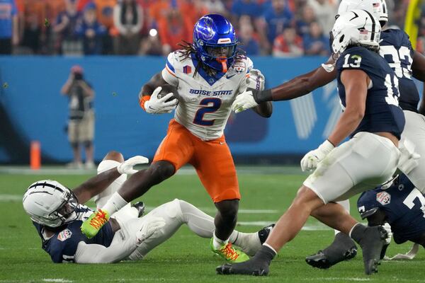 Boise State running back Ashton Jeanty (2) runs the ball against Penn State during the first half of the Fiesta Bowl NCAA college football CFP quarterfinal game, Tuesday, Dec. 31, 2024, in Glendale, Ariz. (AP Photo/Rick Scuteri)