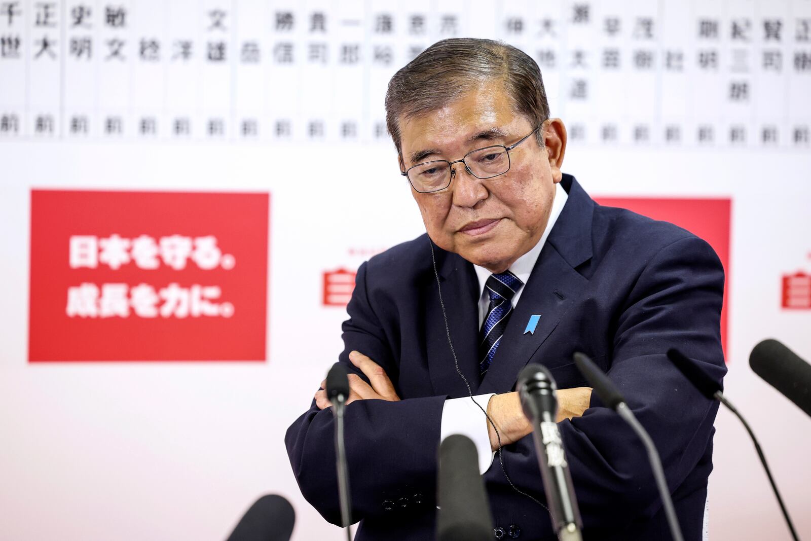 Japan's Prime Minister and president of the Liberal Democratic Party (LDP) Shigeru Ishiba speaks to the media regarding the early result of lower house election, at the LDP headquarters Sunday, Oct. 27, 2024 in Tokyo, (Takashi Aoyama/Pool Photo via AP)