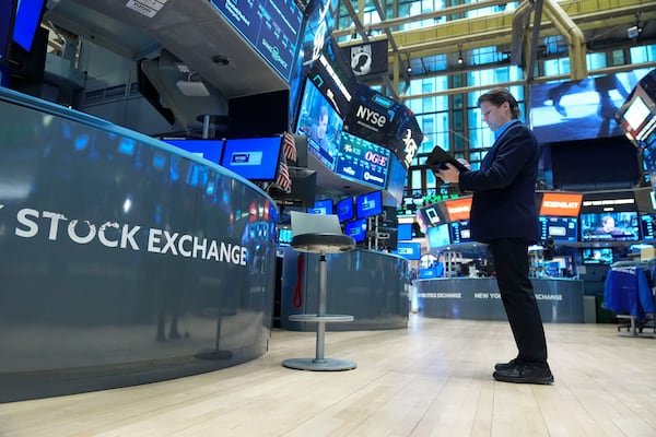 Traders work on the floor at the New York Stock Exchange in New York, Tuesday, Jan. 21, 2025. (AP Photo/Seth Wenig)