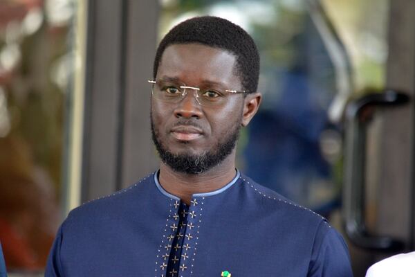 Senegal's President Basirou Diomaye Faye, poses for a photo, prior to the start of the ECOWAS meeting, in Abuja, Nigeria, Sunday, Dec 15, 2024. (AP Photo/Olamikan Gbemiga)