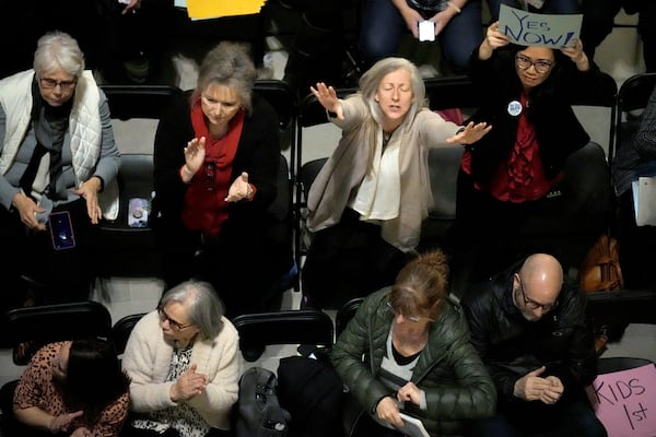 FILE - People applaud during a rally in favor of legislation banning gender-affirming healthcare for minors, Monday, March 20, 2023, at the Missouri Statehouse in Jefferson City, Mo. (AP Photo/Charlie Riedel, File)