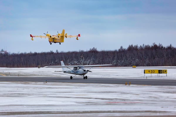 A SOPFEU CL-415 is taking off to help in the California wildfires at the Quebec City airport, Wednesday, Jan. 15, 2025. (Francis Vachon/The Canadian Press via AP)