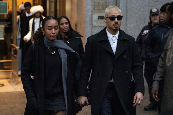 Chance Combs, left, daughter, and Quincy Brown, right, stepson of Sean "Diddy" Combs leave Manhattan federal court, Friday, Nov. 22 2024, in New York. (AP Photo/Yuki Iwamura)