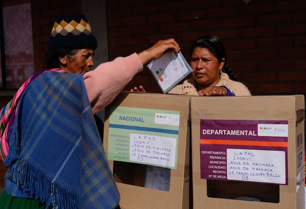 An Aymara woman casts her ballot during judicial elections in Jesus de Machaca, Bolivia, Sunday, Dec. 15, 2024. (AP Photo/Juan Karita)