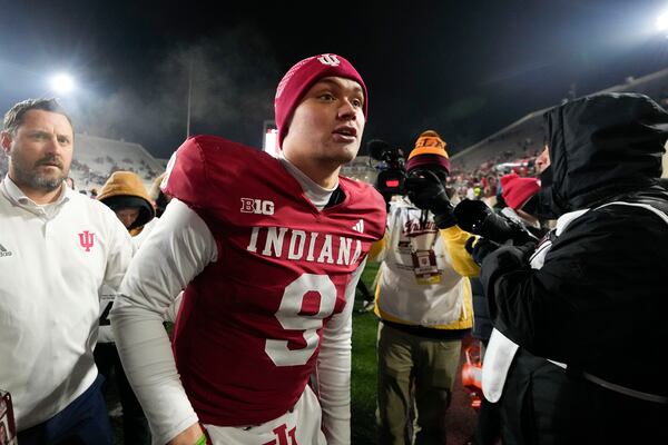 Indiana quarterback Kurtis Rourke (9) runs off the field after the team defeated Purdue in an NCAA college football game, Saturday, Nov. 30, 2024, in Bloomington, Ind. (AP Photo/Darron Cummings)