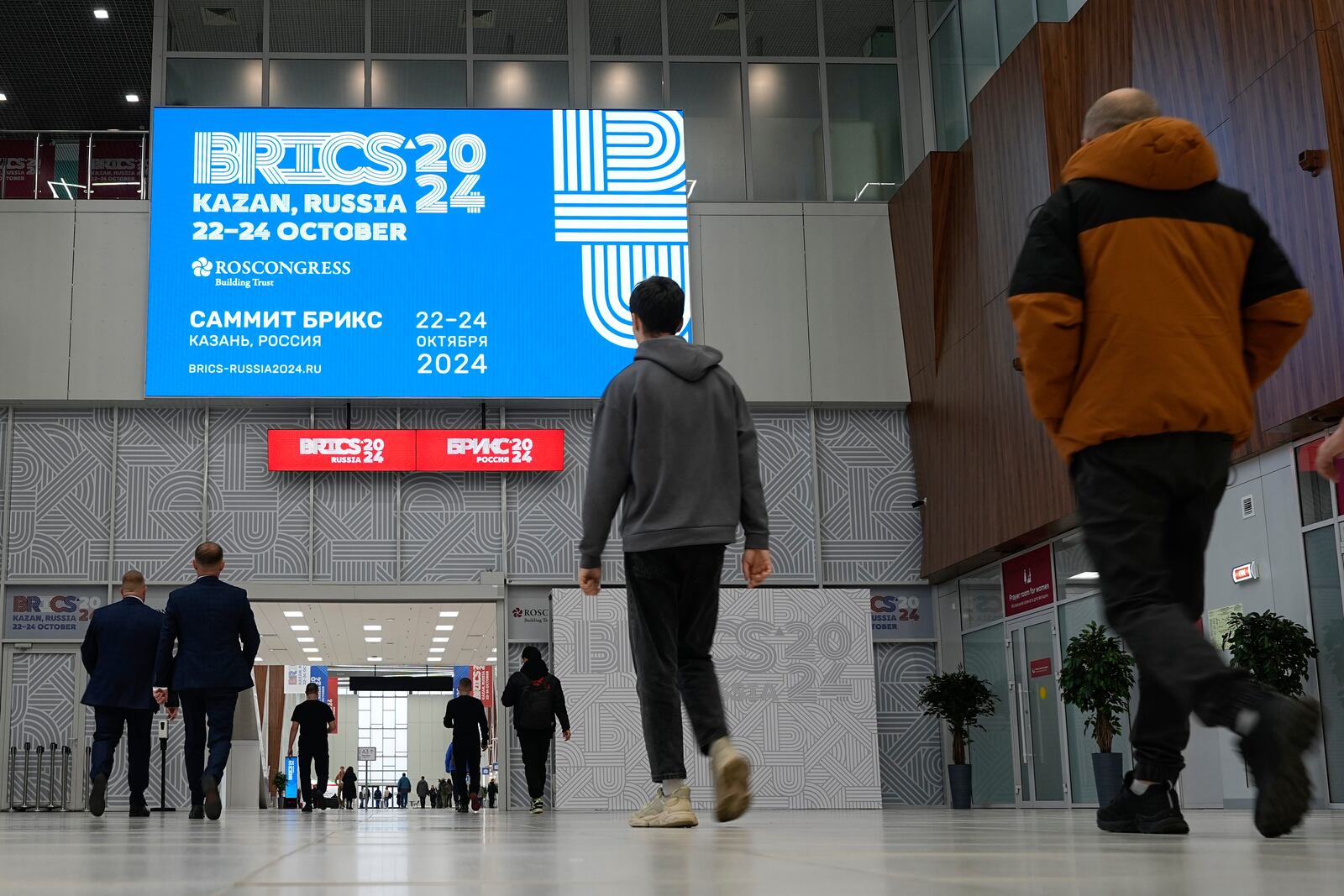 People walk at Kazan Expo the day before BRICS Summit in Kazan, Russia, Monday, Oct. 21, 2024. (AP Photo/Alexander Zemlianichenko)