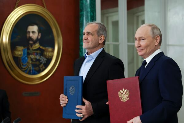 Russian President Vladimir Putin, right, and Iranian President Masoud Pezeshkian attend a signing ceremony for a partnership treaty to deepen their ties after their talks at the Kremlin in Moscow, Russia, Friday, Jan. 17, 2025. (Vyacheslav Prokofyev, Sputnik, Kremlin Pool Photo via AP)