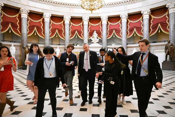 Rep. Matthew Rosendale, R-Mont., talks with reporters after attending a meeting with the Freedom Caucus and Speaker of the House Mike Johnson, R-La., as the House works on a spending bill to avert a shutdown of the Federal Government, Friday, Dec. 20, 2024 in Washington. (AP Photo/John McDonnell)