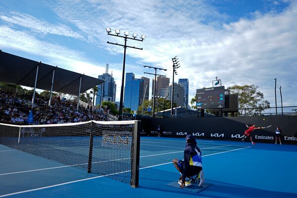 Bu Yunchaokete of China plays a backhand return to Hady Habib of Lebanon during their first round match at the Australian Open tennis championship in Melbourne, Australia, Sunday, Jan. 12, 2025. (AP Photo/Asanka Brendon Ratnayake)