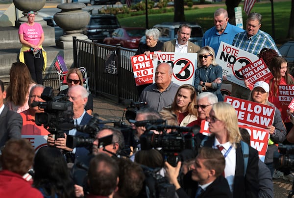 FILE - Abortion opponents watch and pray as members of the media interview attorney Mary Catherine Martin of the conservative Thomas More Society, after Missouri's Supreme Court heard arguments over whether an abortion-rights amendment should go before voters this year on Sept. 10, 2024 in Jefferson City, Mo. (Robert Cohen/St. Louis Post-Dispatch via AP, File)/St. Louis Post-Dispatch via AP)