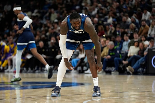 Minnesota Timberwolves forward Julius Randle (30) reacts after missing a shot during the first half of an NBA basketball game against the Los Angeles Lakers, Friday, Dec. 13, 2024, in Minneapolis. (AP Photo/Abbie Parr)