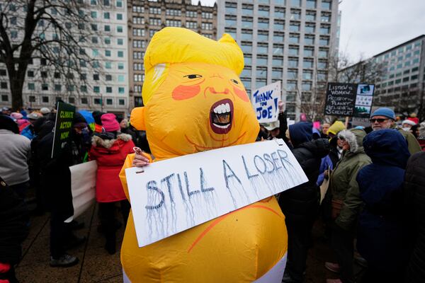 A person wears a costume in Farragut Square before the start of the People's March, Saturday, Jan. 18, 2025, in Washington. (AP Photo/Mike Stewart)