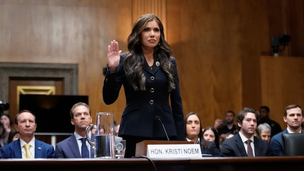 South Dakota Gov. Kristi Noem, President-elect Donald Trump's nominee to be Secretary of Homeland Security, is sworn in before the Senate Homeland Security and Governmental Affairs Committee for her confirmation hearing, at the Capitol in Washington, Friday, Jan. 17, 2025. (AP Photo/Ben Curtis)