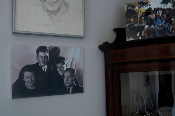 A portrait of Holocaust survivor Naftali Fürst, his parents and his brother, reunited after their 1944 separation at Auschwitz concentration camp, is displayed at his home in Haifa, Israel, Tuesday, Jan. 14, 2025. (AP Photo/Maya Alleruzzo)