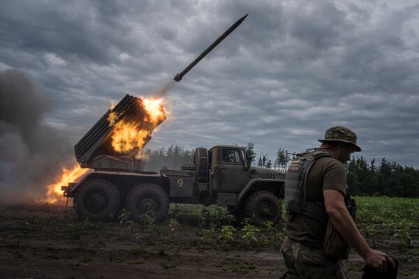 FILE - Ukrainian forces shoot toward Russian positions at the front line in the Kharkiv region of Ukraine, on Aug. 2, 2022. (AP Photo/Evgeniy Maloletka, File)