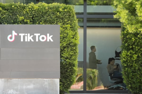 FILE - People work inside the TikTok Inc. building in Culver City, Calif., on March 11, 2024. (AP Photo/Damian Dovarganes, File)