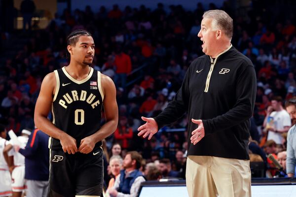 Purdue head coach Matt Painter talks with guard C.J. Cox (0) during the second half of an NCAA college basketball game against Auburn, Saturday, Dec. 21, 2024, in Birmingham, Ala. (AP Photo/ Butch Dill)