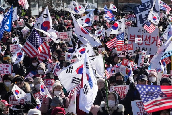 Supporters of impeached South Korean President Yoon Suk Yeol stage a rally to oppose his impeachment near the presidential residence in Seoul, South Korea, Friday, Jan. 10, 2025. (AP Photo/Ahn Young-joon)