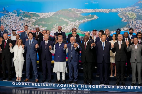 FILE - Chinese President Xi Jinping, third right in front, and world leaders attending the G20 Summit pose for a group photo in Rio de Janeiro on Nov. 19, 2024. (AP Photo/Eraldo Peres, File)